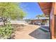 Expansive backyard featuring a covered patio, mature tree, and ample space for recreation and relaxation at 6728 N 24Th Dr, Phoenix, AZ 85015