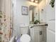 Bathroom featuring updated vanity, white cabinets and new lighting fixture at 6728 N 24Th Dr, Phoenix, AZ 85015