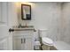 Updated bathroom featuring vanity, white toilet and updated tile shower at 6728 N 24Th Dr, Phoenix, AZ 85015