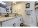 Bright bathroom features granite countertops, white cabinets, and black hardware at 6728 N 24Th Dr, Phoenix, AZ 85015