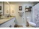 Bright bathroom features granite countertops, white cabinets, and wood look tile at 6728 N 24Th Dr, Phoenix, AZ 85015