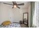 Bedroom featuring a ceiling fan, full-length mirror and neutral paint scheme at 6728 N 24Th Dr, Phoenix, AZ 85015