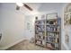 Bright bedroom features neutral carpet, ceiling fan and a bookcase at 6728 N 24Th Dr, Phoenix, AZ 85015