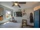 Bedroom features checkered bedspread, butterfly decals and a television at 6728 N 24Th Dr, Phoenix, AZ 85015