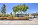 Charming house with well manicured front lawn and landscaped accents, complemented by a basketball hoop on the driveway at 6728 N 24Th Dr, Phoenix, AZ 85015
