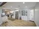 Spacious kitchen features stainless steel appliances, white cabinets, and wood-look tile at 6728 N 24Th Dr, Phoenix, AZ 85015
