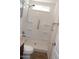 Bathroom featuring a stand up shower with multiple ledges and safety bar at 7807 E Main St # H7, Mesa, AZ 85207