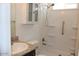 Bathroom featuring a walk-in shower, vanity with countertop, and storage at 7807 E Main St # H7, Mesa, AZ 85207