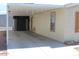 Exterior view featuring covered carport with storage area and comfortable outdoor seating at 7807 E Main St # H7, Mesa, AZ 85207