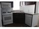 Well-equipped kitchen featuring updated appliances and dark cabinetry at 7807 E Main St # H7, Mesa, AZ 85207