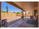 Spacious backyard featuring a covered patio, low-maintenance desert landscaping and privacy fencing at 9234 W Sierra Pinta Dr, Peoria, AZ 85382