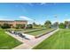 Outdoor bocce ball courts surrounded by manicured lawns and landscaping, perfect for recreation and leisure at 9234 W Sierra Pinta Dr, Peoria, AZ 85382