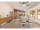 Bright, airy dining area featuring stainless steel appliances and stylish tile floors at 9234 W Sierra Pinta Dr, Peoria, AZ 85382
