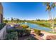 Scenic view of a pond on the golf course, enhanced by a fountain, seen from a patio at 9234 W Sierra Pinta Dr, Peoria, AZ 85382