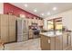 Updated kitchen with stainless steel appliances, granite counters, and a garden window at 9234 W Sierra Pinta Dr, Peoria, AZ 85382