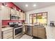 Close-up of the kitchen with stainless steel appliances and granite countertops at 9234 W Sierra Pinta Dr, Peoria, AZ 85382