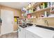 Bright laundry room with modern washer and dryer and convenient shelving for storage at 9234 W Sierra Pinta Dr, Peoria, AZ 85382