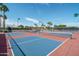 Outdoor pickleball courts featuring colorful surfaces, professional nets, and ample space for players under a bright, clear sky at 9234 W Sierra Pinta Dr, Peoria, AZ 85382