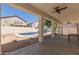 Inviting covered back patio overlooking the private pool and gravel landscaping at 9518 W Hazelwood St, Phoenix, AZ 85037