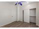 Cozy bedroom with wood-look flooring and closet at 9518 W Hazelwood St, Phoenix, AZ 85037
