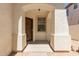Inviting front porch features a decorative security door and charming brick-lined flooring at 9518 W Hazelwood St, Phoenix, AZ 85037
