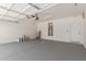 Well-lit garage offers plenty of space for parking, storage, and home maintenance at 9518 W Hazelwood St, Phoenix, AZ 85037