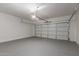 Spacious garage with high ceilings, providing ample space for vehicles and storage at 9518 W Hazelwood St, Phoenix, AZ 85037