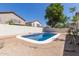 Secluded backyard pool area surrounded by lush plants offer privacy and a calming oasis at 9518 W Hazelwood St, Phoenix, AZ 85037