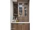 Custom bar showcasing wine storage, glassware display, and ample counter space for entertaining at 10025 E Larkspur Dr, Scottsdale, AZ 85260