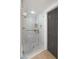 Contemporary shower with glass enclosure, gray tile, and sleek fixtures at 10025 E Larkspur Dr, Scottsdale, AZ 85260