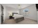 Bedroom features a plush bed, nightstand, large window, and plenty of space at 10025 E Larkspur Dr, Scottsdale, AZ 85260