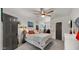 Bedroom features an inviting bed, a ceiling fan, natural light, and modern interior design at 10025 E Larkspur Dr, Scottsdale, AZ 85260