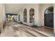 Elegant home featuring an inviting covered drive-through and beautiful arched windows and a double-door entrance at 10025 E Larkspur Dr, Scottsdale, AZ 85260