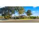 Charming single-Gathering home with a beautiful front lawn, mature trees, and a welcoming curb appeal at 10025 E Larkspur Dr, Scottsdale, AZ 85260