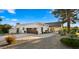 Attractive home exterior with well-manicured landscaping, tile roof, and inviting driveway at 10025 E Larkspur Dr, Scottsdale, AZ 85260
