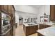 Gourmet kitchen with stainless steel appliances, custom wood cabinets, and a spacious center island at 10025 E Larkspur Dr, Scottsdale, AZ 85260