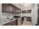 Functional laundry room with modern appliances, ample counter space, and custom cabinetry at 10025 E Larkspur Dr, Scottsdale, AZ 85260