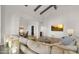 Cozy living room with comfortable seating, wooden beams, and modern decor at 10025 E Larkspur Dr, Scottsdale, AZ 85260