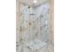 Spa-like shower with marble tile, glass enclosure, and upscale fixtures enhancing the bathing experience at 10025 E Larkspur Dr, Scottsdale, AZ 85260