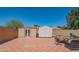 Large backyard with patio, outdoor seating, mature tree, and storage sheds at 102 E Angela Dr, Phoenix, AZ 85022