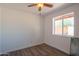 Bedroom featuring a bright window and a ceiling fan, offering a clean and simple design at 102 E Angela Dr, Phoenix, AZ 85022