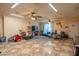 Bonus room with vintage floor tiles, ceiling fans, and a comfortable seating area with tv at 102 E Angela Dr, Phoenix, AZ 85022