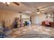 Large bonus room featuring tile floors and a ceiling fan, perfect for entertainment and relaxation at 102 E Angela Dr, Phoenix, AZ 85022