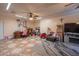 Spacious bonus room with unique tile flooring, ceiling fan, and ample storage at 102 E Angela Dr, Phoenix, AZ 85022