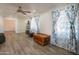 Well-lit living room featuring ceiling fan, modern flooring and ample space offering cozy living environment at 102 E Angela Dr, Phoenix, AZ 85022