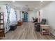 Inviting living room featuring wood-look floors, a ceiling fan, and bright natural light at 102 E Angela Dr, Phoenix, AZ 85022