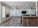 Bright living room featuring tile fireplace, wood look floors, and lots of space at 102 E Angela Dr, Phoenix, AZ 85022