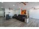 Cozy open concept living room with wood look floors and comfortable seating at 102 E Angela Dr, Phoenix, AZ 85022