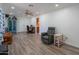 Cozy living room including ceiling fan, recessed lights, and modern flooring offering comfort and style at 102 E Angela Dr, Phoenix, AZ 85022