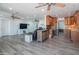 Spacious living area with wood look flooring, ceiling fans, and ample space for entertaining at 102 E Angela Dr, Phoenix, AZ 85022